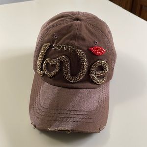 Brown and red “love” hat. Gold rhinestones, adjustable strap, cotton